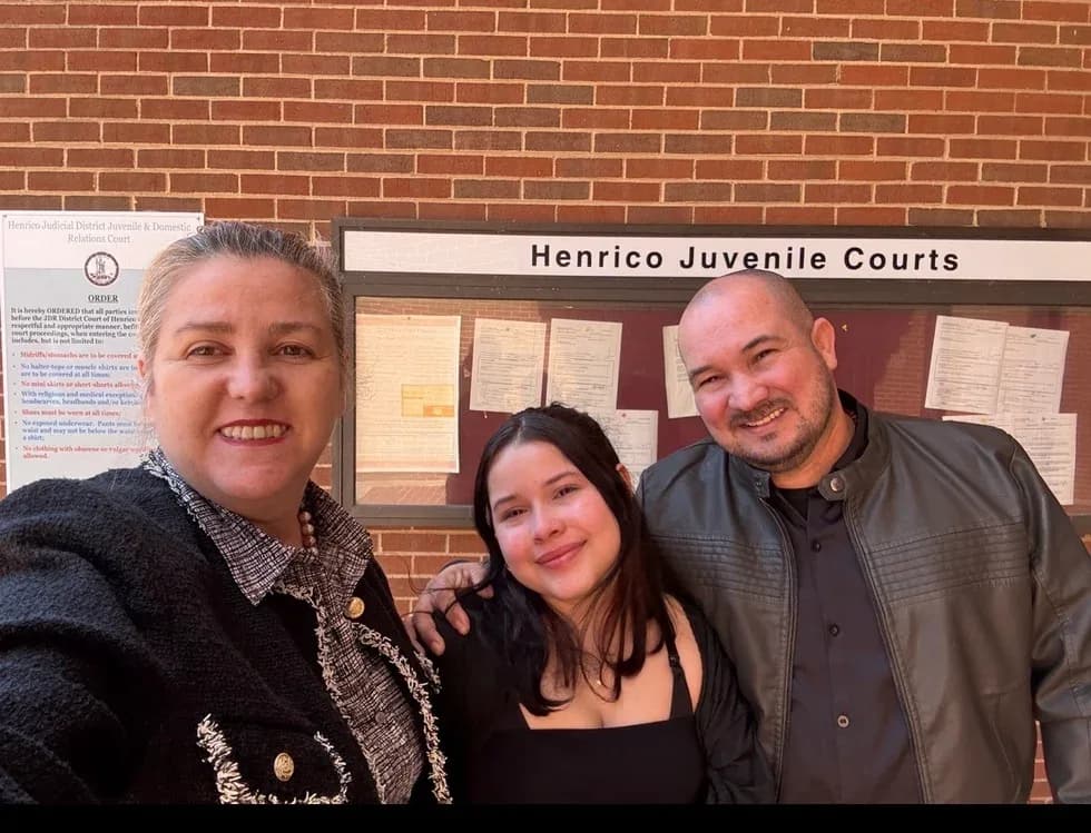 Maria Eijo stands with a young woman and a man outside Henrico Juvenile Courts.